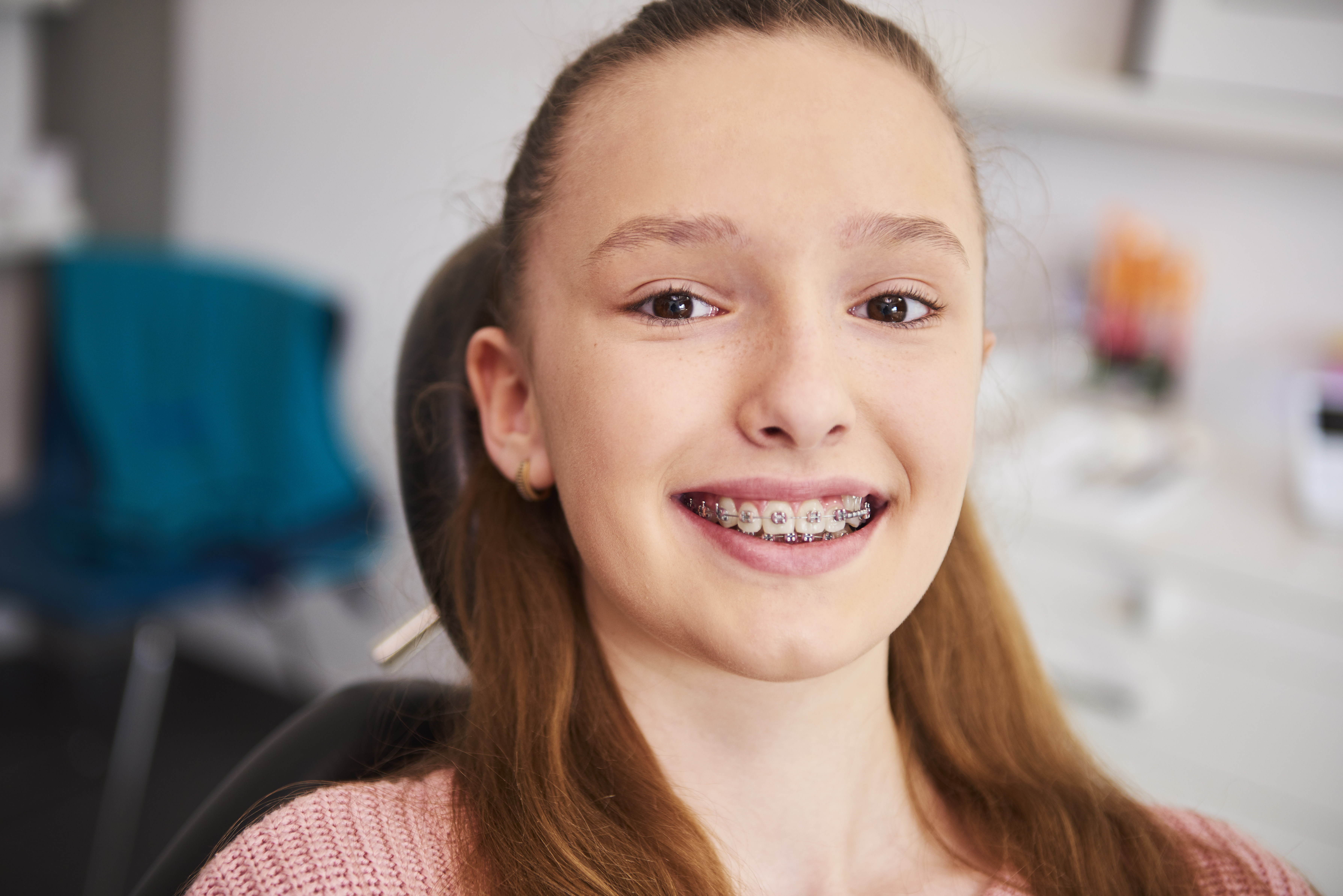 Portrait Smiling Child With Braces Dentist S Office